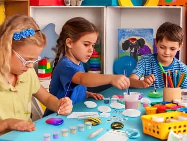 Child holding number learning board