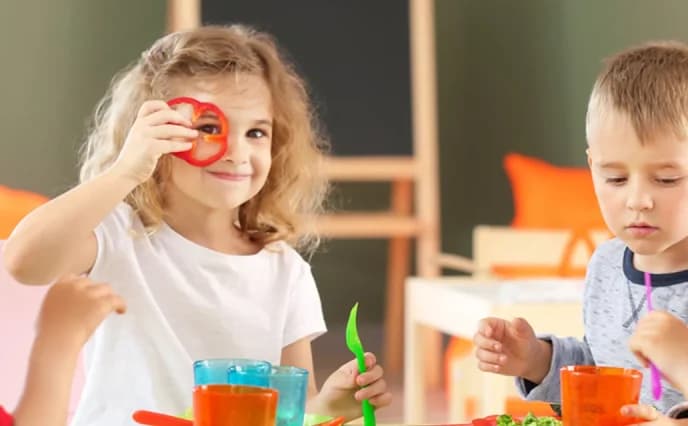 Children taking part in classroom creative activity